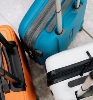 two pieces of luggage sitting next to each other
