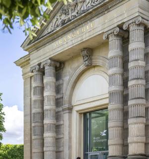 a group of people standing outside of a building