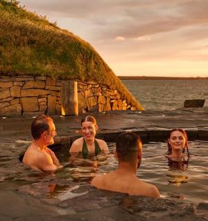 a group of people in the water in a hot tub