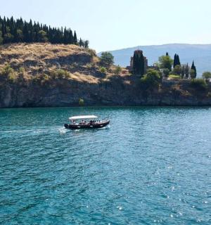 a boat in the water near a small island