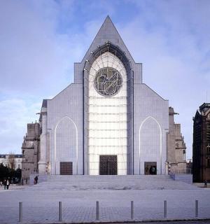 a large white building with a clock on it