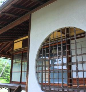 a building with a large window with a table in it