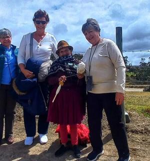 a group of women posing for a picture with a child