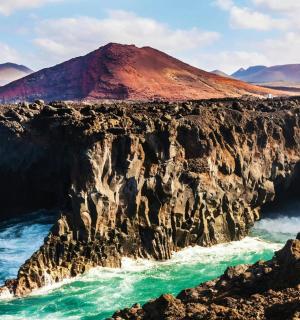 a view of the ocean and a mountain