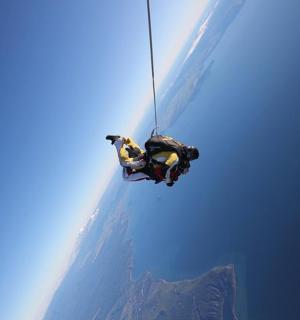 a person rappelling from a rappelling ropektopktop