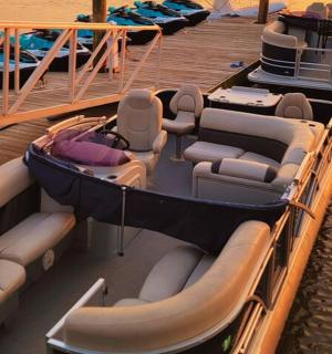 two boats are docked on a dock in the water