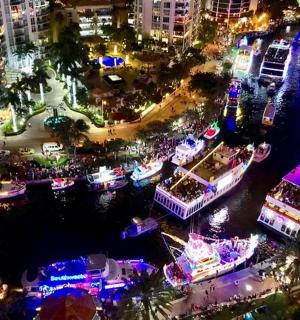 a group of boats in the water at night