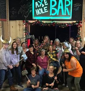 a group of people posing for a picture in a bar