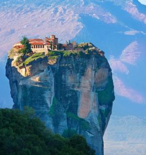 a house perched on top of a mountain