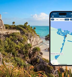 a cell phone with a map on a beach