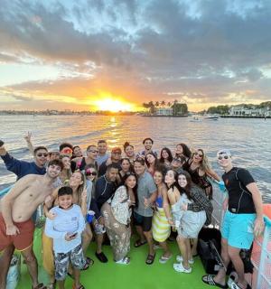 a group of people on a boat in the water