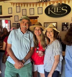 a group of people posing for a picture in a restaurant
