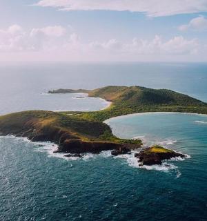 an aerial view of an island in the ocean