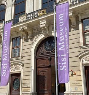 a building with purple signs on the front of it
