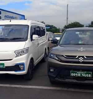 two vehicles parked next to each other in a parking lot