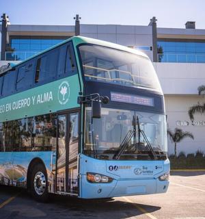 a double decker bus parked in front of a building