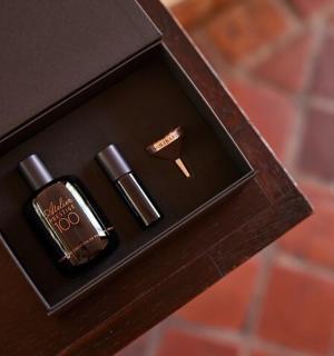 a wooden box with two plugs in it