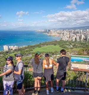 a group of people standing at the top of a mountain