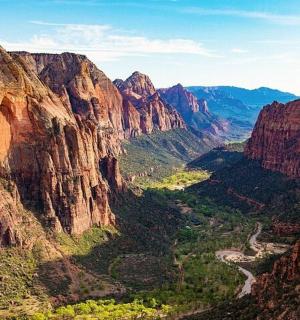 a view of a canyon with a river in it