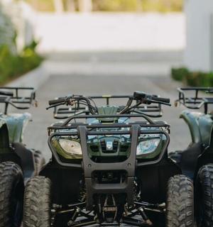 a group of four four wheelers parked next to each other