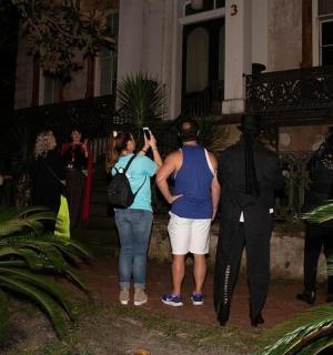 a group of people standing outside of a building