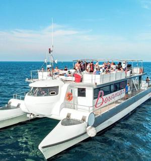a group of people on a boat in the water