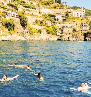 a group of people swimming in the water