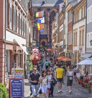 a group of people walking down a city street