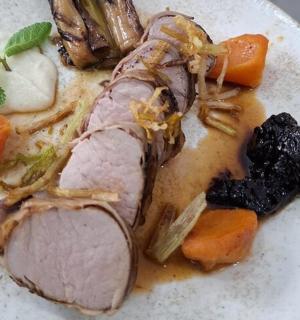 a plate of food with meat and vegetables on it