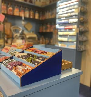 two boxes of food sitting on a counter in a store