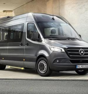 a silver van parked on the side of a street