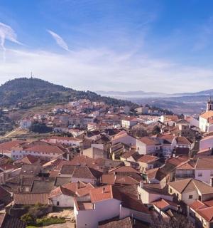 a view of a town with houses on a hill