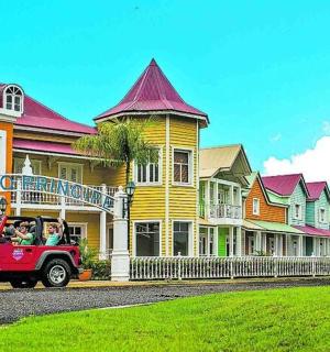 a red truck parked in front of a house