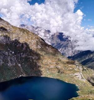 a view of a mountain with a large blue lake