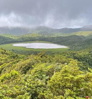 a view of a lake in the middle of a mountain
