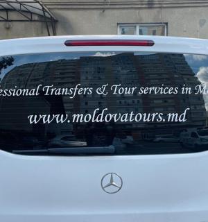 a back window of a white car with a sign on it