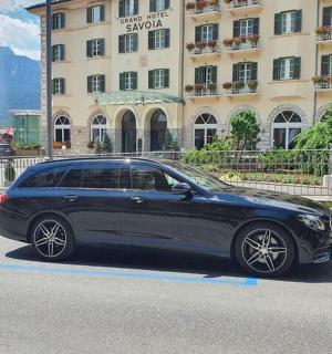 a black car parked in front of a building