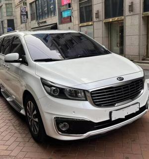 a white car parked on the side of a street