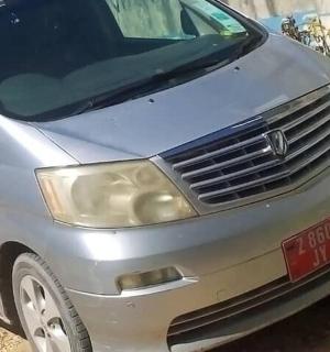 a silver car parked on the side of a road