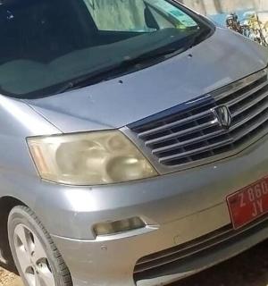 a silver car parked on the side of a road