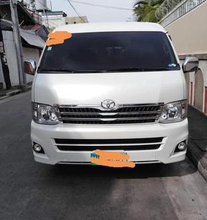 a white van parked on a street with a tag on it