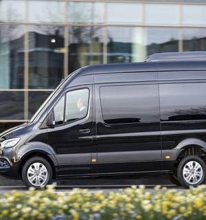 a black van parked in front of a building