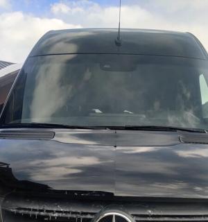 a black van parked in front of a house