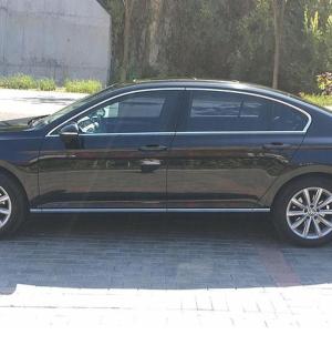 a black car parked in a parking lot