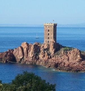a lighthouse on an island in the water