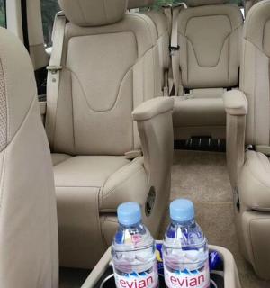 two bottles of water sitting in the back seats of a car