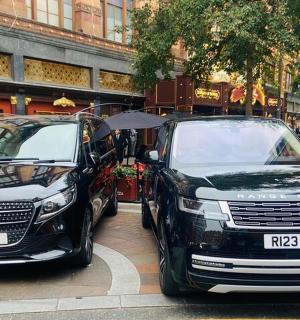 two cars parked next to each other on a street