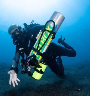 a person in the water with a scuba diver