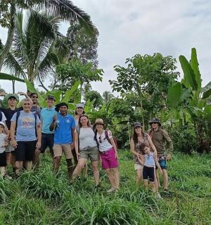 a group of people posing for a picture in a field
