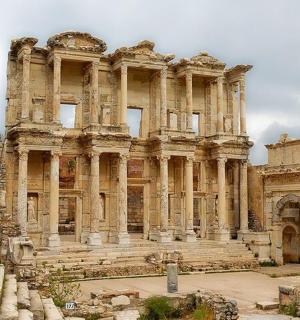 a large stone building with steps in front of it